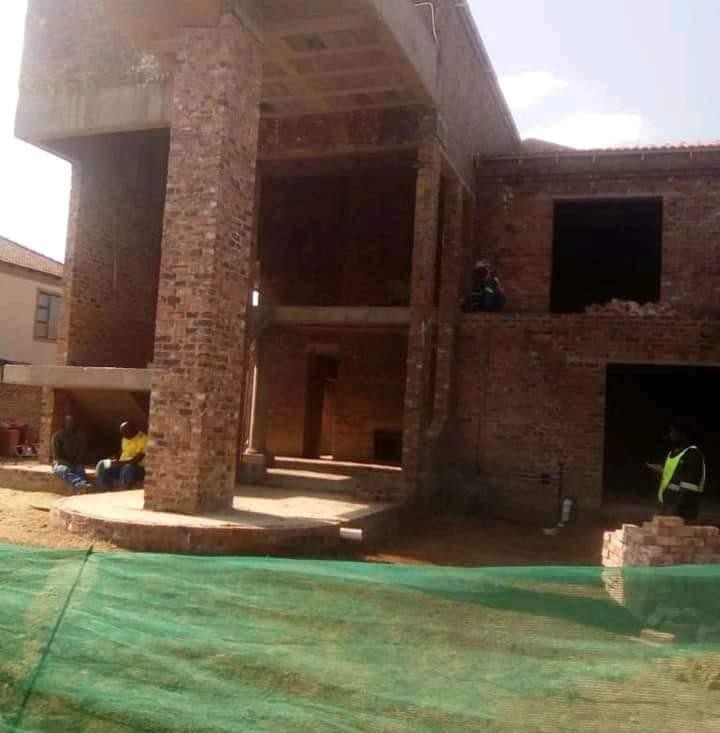 Brick house construction site with the FWB Holdings team at work